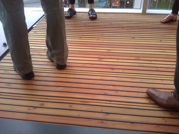 The floor is made of strips of Douglas Fir wood combined with thin metal bars that serve several purposes: traction for feet, and to preserve the wood for much longer. Photo credit: Louisa Gaylord